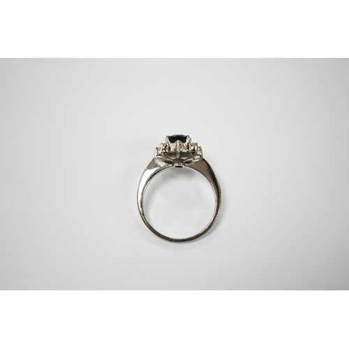 1990 - An 18k white metal, sapphire and diamond set cluster ring, size L, gross weight 2.5 grams.