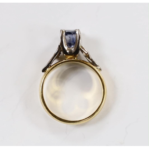 1991 - An 18ct and single stone oval cut sapphire set dress ring, with diamond set shoulders, size I, gross... 