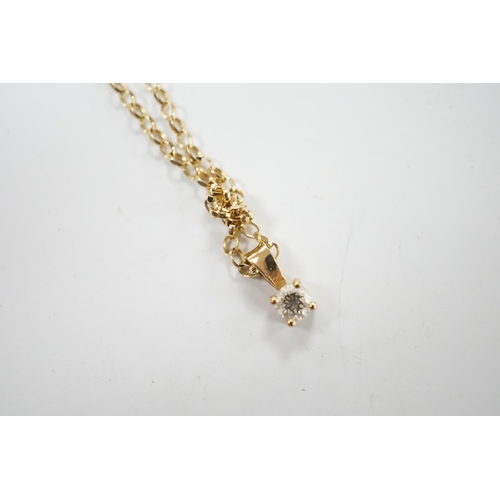 1995 - A modern 9ct gold and solitaire diamond set pendant, 9mm, on a 9ct chain, 38cm, gross weight 2.2 gra... 