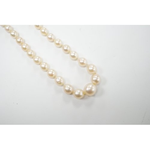 1996 - A single strand graduated cultured pearl necklace with millegrain set diamond cluster and yellow met... 