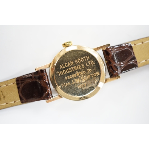 2002 - A lady's 1970's 9ct gold Omega manual wind wrist watch, with case back inscription, on associated le... 