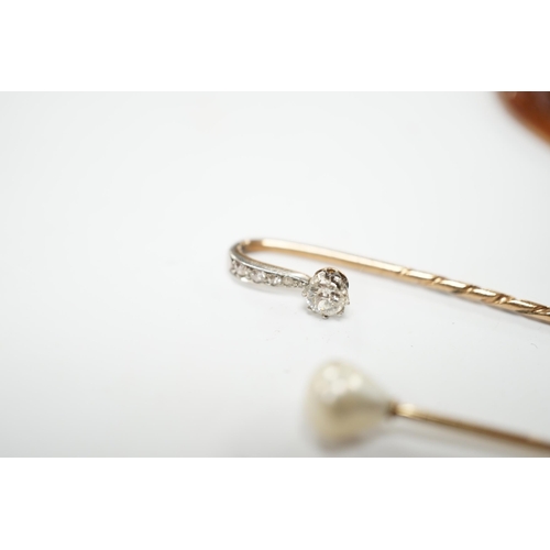 2004 - A yellow metal and diamond cluster set stick pin, 69mm, a yellow metal and cultured pearl set stick ... 