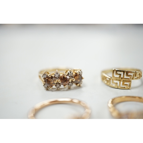 2005 - Three assorted modern 585 yellow metal and gem set rings, including two rose coloured and a 585 'Gre... 