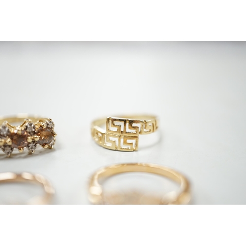 2005 - Three assorted modern 585 yellow metal and gem set rings, including two rose coloured and a 585 'Gre... 