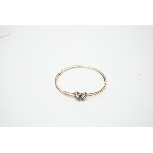 2009 - A late Victorian yellow metal and rose cut diamond set twin hearts bangle, gross weight 6.8 grams.... 