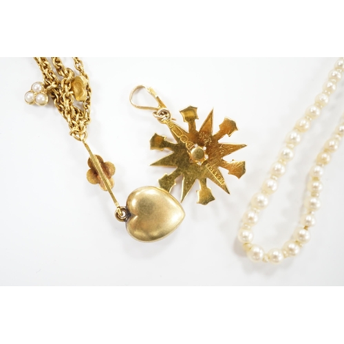 2028 - An Edwardian 15ct gold and seed pearl set starburst pendant, overall 25mm, together with a similar y... 