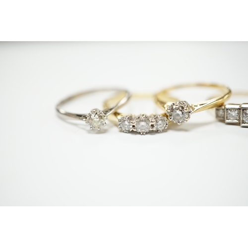 2034 - Four assorted 18ct and diamond set rings including a graduated five stone, three stone and two solit... 