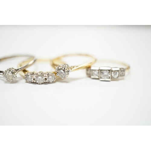 2034 - Four assorted 18ct and diamond set rings including a graduated five stone, three stone and two solit... 