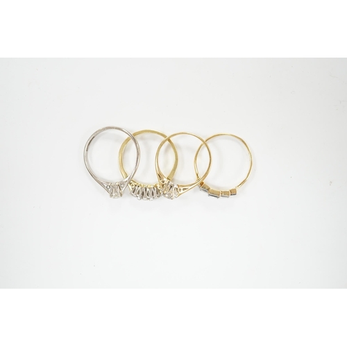 2034 - Four assorted 18ct and diamond set rings including a graduated five stone, three stone and two solit... 