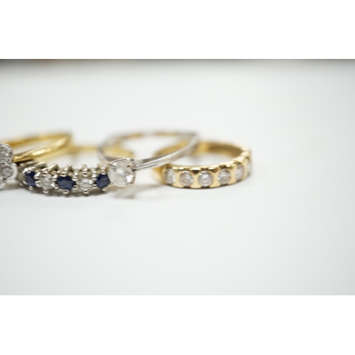 2035 - Four assorted 18ct and diamond set rings, including solitaire, flower head cluster, three stone cros... 