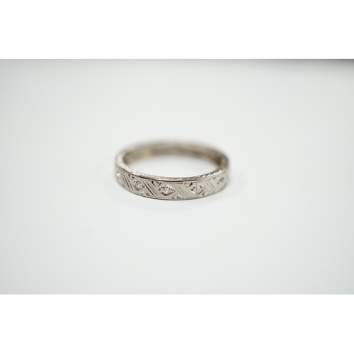 2052 - An 18ct white metal and diamond chip set full eternity ring, size K, gross weight 3 grams.