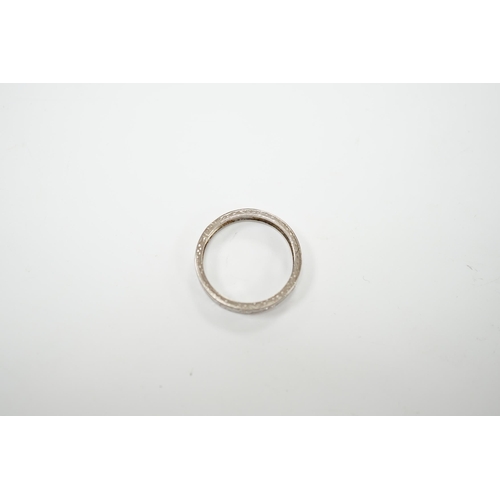 2052 - An 18ct white metal and diamond chip set full eternity ring, size K, gross weight 3 grams.