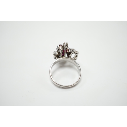 2053 - A recent 18k white metal, ruby and diamond cluster set modernist dress ring, size N/O, gross weight ... 