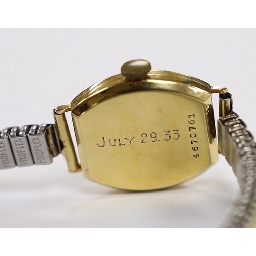 2060 - A lady's 1930's 18ct gold Longines manual wind wrist watch, with case back inscription, on a later a... 