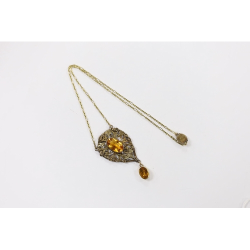 2073 - A yellow metal, white metal and two stone citrine set drop pendant necklace, with citrine set clasp,... 