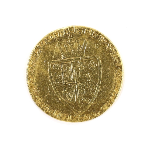 2095 - British gold coins, George III gold spade guinea 17?9, demounted and pitted otherwise near VF