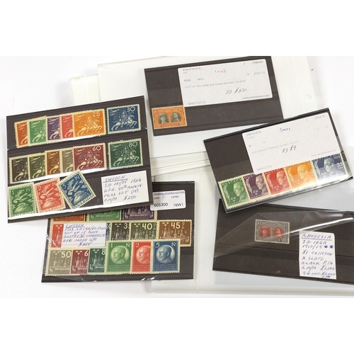 2179 - A selection of stamps with Rhodesia 1902-13 Double Heads to 2/-, 2/6d, (2), 5/-, 7/6d, 10/- and £1 i... 