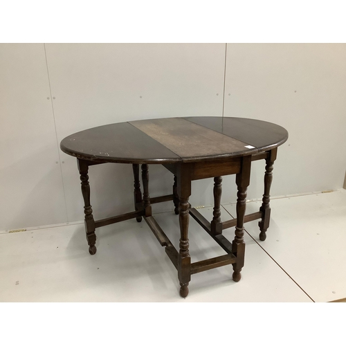 109 - An 18th century style oak gateleg dining table, width 98cm, depth 42cm, height 75cm