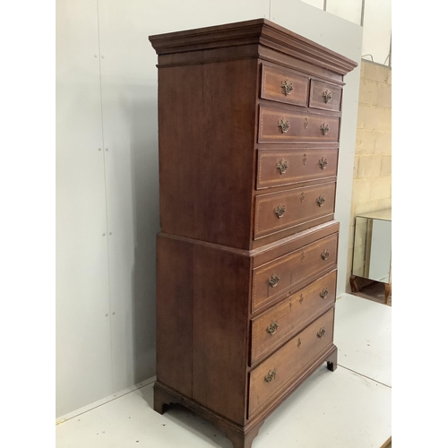 116 - A George III feather banded oak chest on chest, width 102cm, depth 58cm, height 181cm