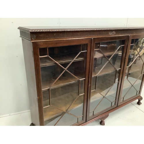 117 - A 1920s Chippendale revival glazed mahogany bookcase, width 183cm, depth 38cm, height 132cm