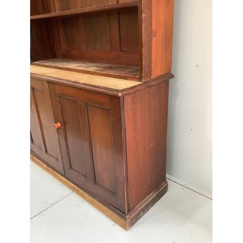 124 - A Victorian mahogany bookcase cupboard, width 127cm, depth 47cm, height 221cm