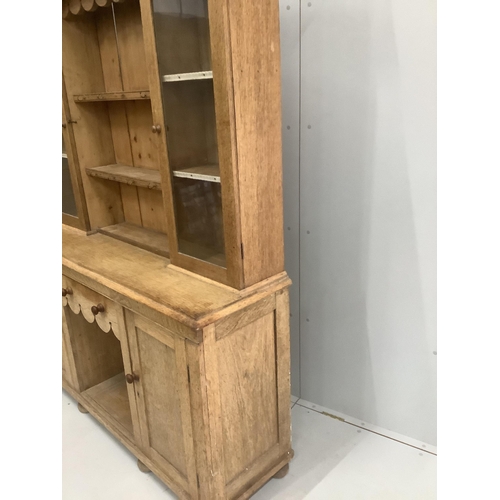 125 - A late Victorian pale oak dresser, width 151cm, depth 44cm, height 202cm