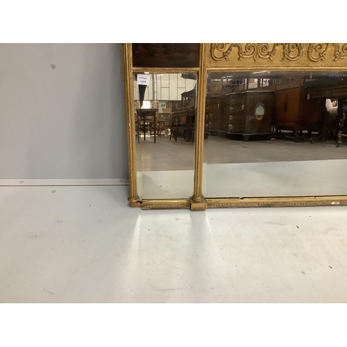 15 - A Regency triple plate gilt-framed overmantel mirror with painted panels, width 150cm, height 74cm... 