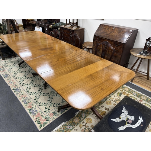 162 - A George III style mahogany triple pillar extending dining table, 346cm extended, two spare leaves, ... 