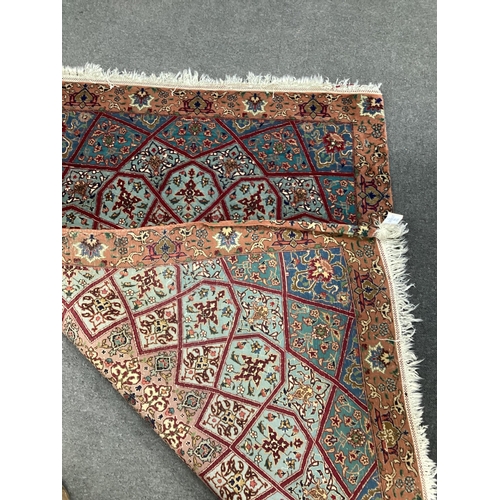 177 - A North West Persian peach ground rug, 140 x 100cm