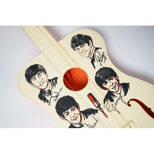 251 - The Beatles plastic toy guitar by Selcol, 59cm