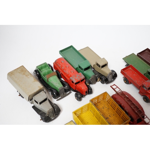 254 - Twenty-five Dinky Toys and Atlas Dinky including a few pre-war examples; Delivery lorries, Market Ga... 