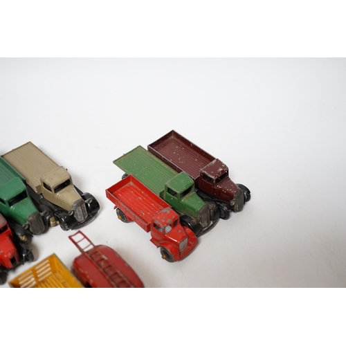 254 - Twenty-five Dinky Toys and Atlas Dinky including a few pre-war examples; Delivery lorries, Market Ga... 