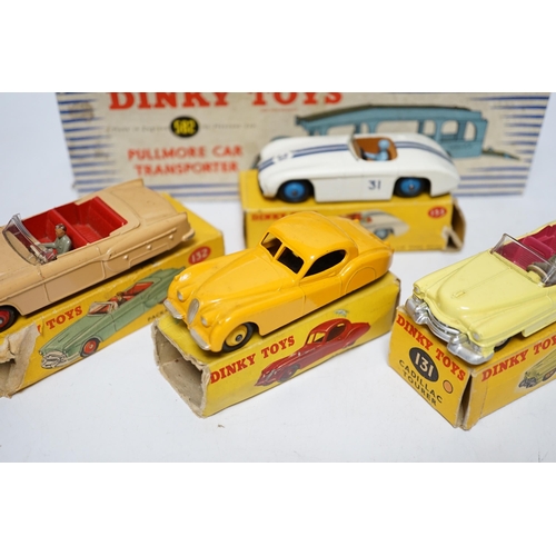 261 - Five boxed Dinky Toys; (132) a Packard Convertible, (131) a Cadillac Tourer, (133) a Cunningham C-5R... 