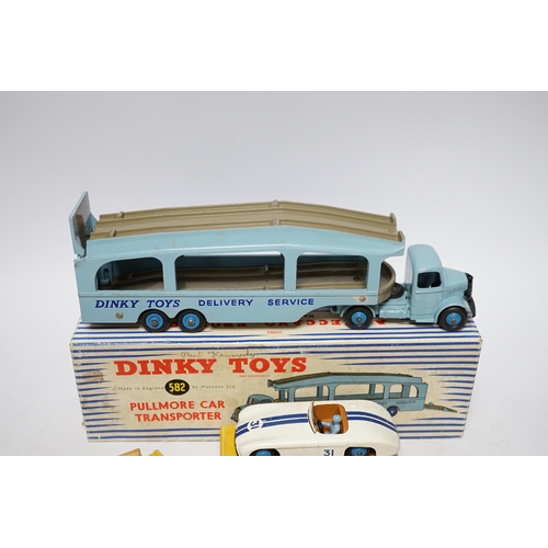 261 - Five boxed Dinky Toys; (132) a Packard Convertible, (131) a Cadillac Tourer, (133) a Cunningham C-5R... 