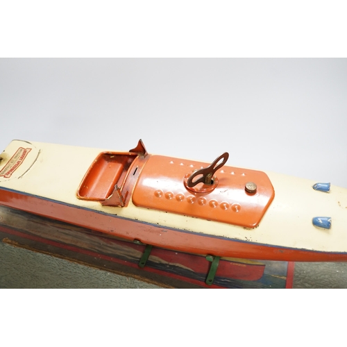 265 - A boxed, Hornby No.3 Condor clockwork speed boat, with original stand, length of hull 41.5cm