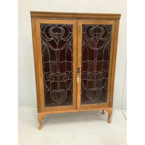 29 - A pair of Art Nouveau stained glass panels, now as an oak bookcase, width 104cm, depth 29cm, height ... 