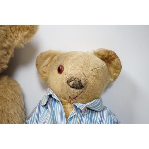 305 - Two Invicta bears, 30cm and 45cm, some wear, and a Merrythought bear, dressed in vintage dressing go... 