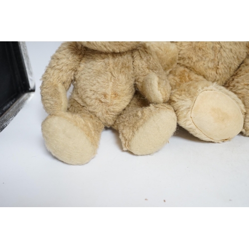 305 - Two Invicta bears, 30cm and 45cm, some wear, and a Merrythought bear, dressed in vintage dressing go... 