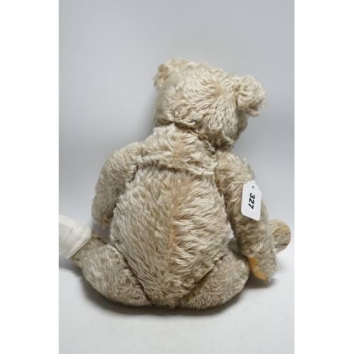 327 - Steiff bear, c.1950's, button and label, 50cm, one ear loose, holes to paw pads, small patch of wear... 