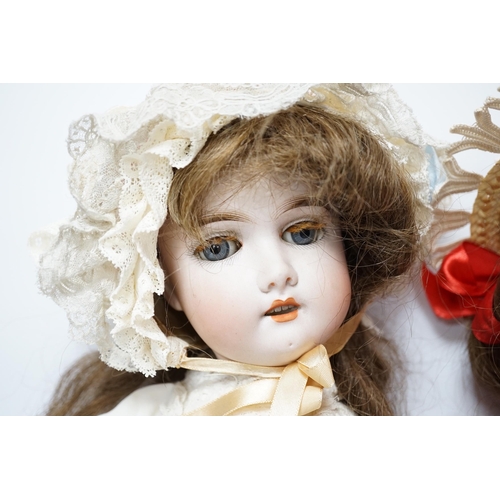 353 - A Gebruder Kuhnlenz K168 doll, 58cm, good condition, and a Heinrich Handwerck Simon & Halbig doll, 4... 