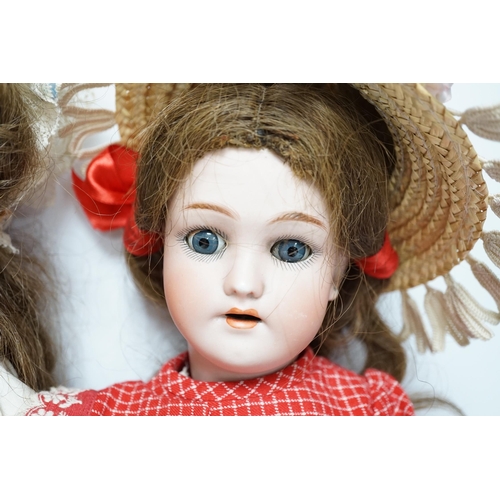 353 - A Gebruder Kuhnlenz K168 doll, 58cm, good condition, and a Heinrich Handwerck Simon & Halbig doll, 4... 