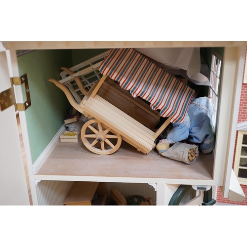 361 - A modern Georgian style dolls house, with two front opening doors, containing six rooms with furnish... 