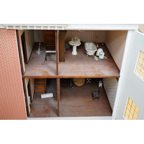 361 - A modern Georgian style dolls house, with two front opening doors, containing six rooms with furnish... 