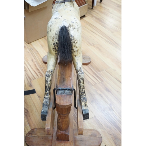 364 - A Rocking horse on a wooden pedestal rocker, with plaster, composite body, height, 97cm, length 152c... 