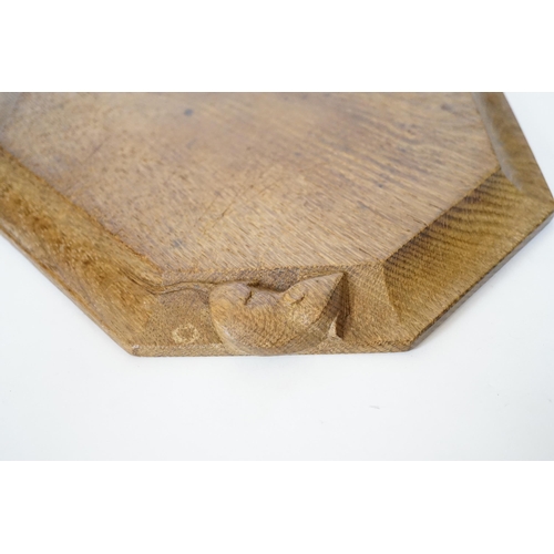 384 - A Robert Mouseman Kilburn octagonal carved oak breadboard, 30x25cm