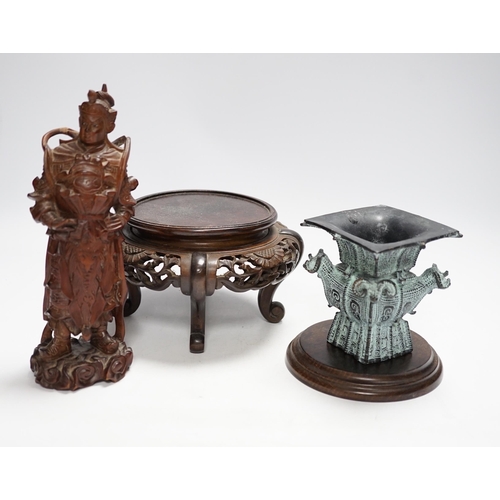 394 - Chinese wood figure of a warrior, two wood stands and a bronze zun vessel