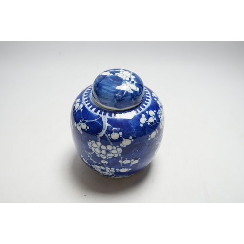 399 - A Chinese blue and white prunus jar and cover, 14cm