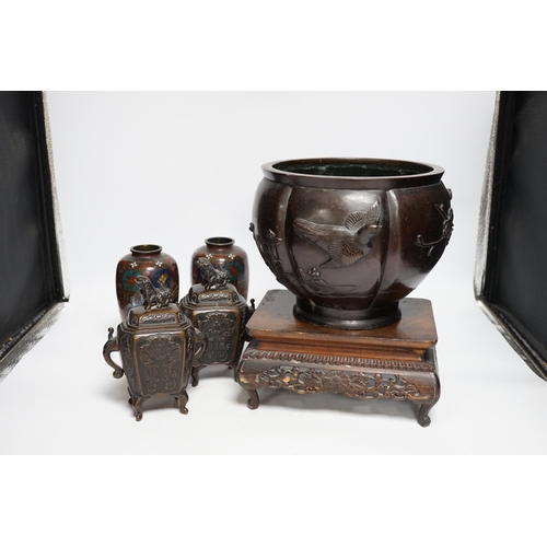 404 - A Meiji period Japanese bronze jardiniere, a pair of cloisonné vases, a hardwood stand, etc.