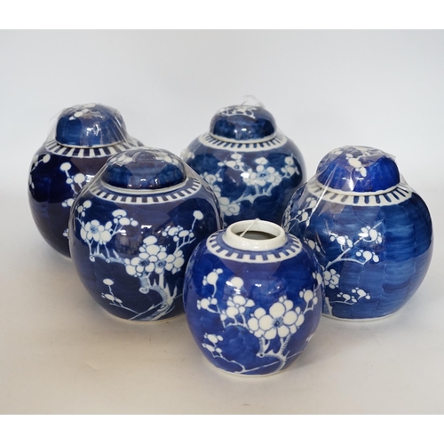 411 - Five Chinese blue and white prunus jars and covers