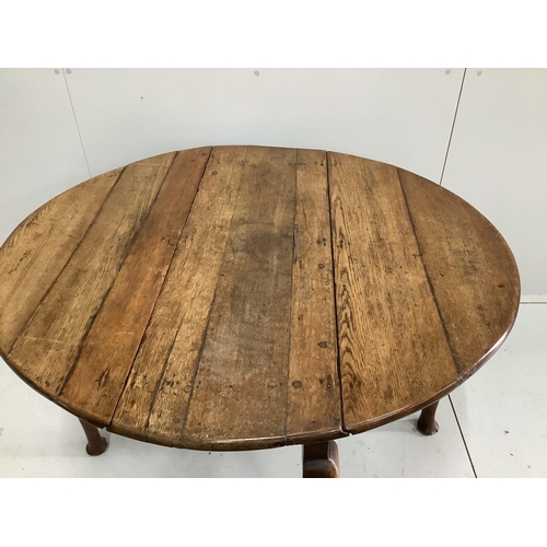 45 - An 18th century provincial oak drop leaf pad foot table, width 104cm, depth 38cm, height 71cm